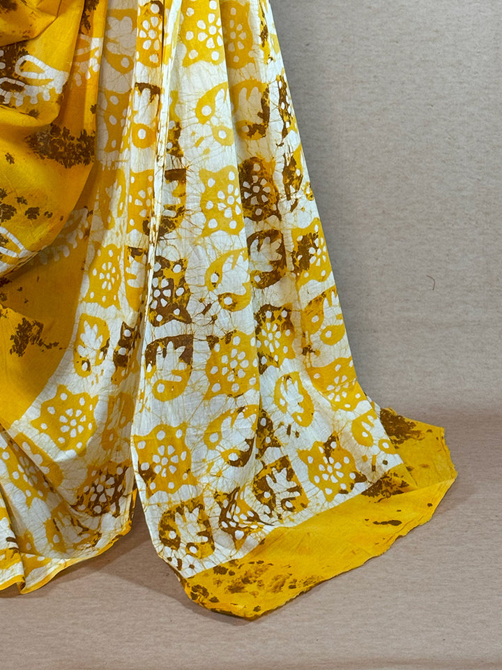 Hand dyed shibori cotton saree yellow with brown and white print